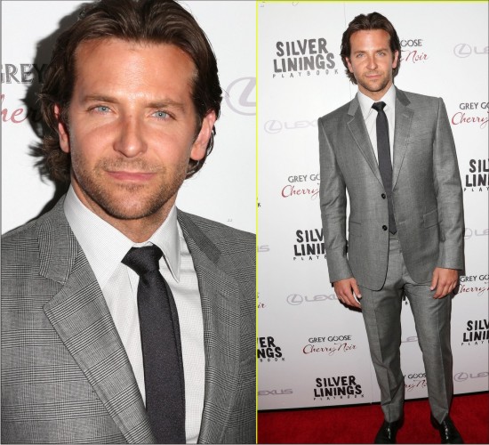 HOT BARDLEY COOPER IN FASHION WEARING A SILVER SUIT ON THE RED CARPET.