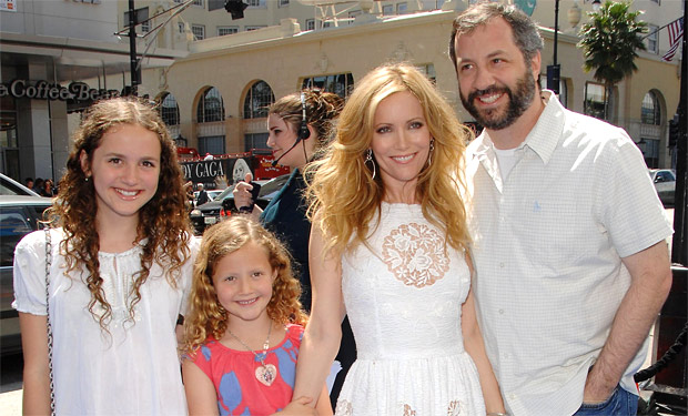 GROUP SHOT OF APATOW FAMILY ALL WEARING WHITE EXPECT FOR IRIS APATOW WHIO STANDS OUT.