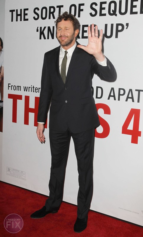 FULLY BODY - CHRIS O'DOWD STANDING IN FRONT OF THE "THIS IS 40" MOVIE POSTER SMILING AND WAVING TO HIS FANS. 