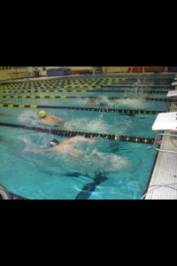 Devin competing in a swimming competition