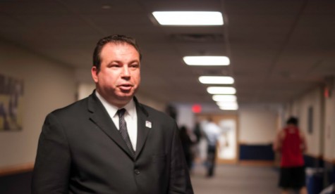 Jeff Deskovic walking the hallway of his alma mater, Mercy College.