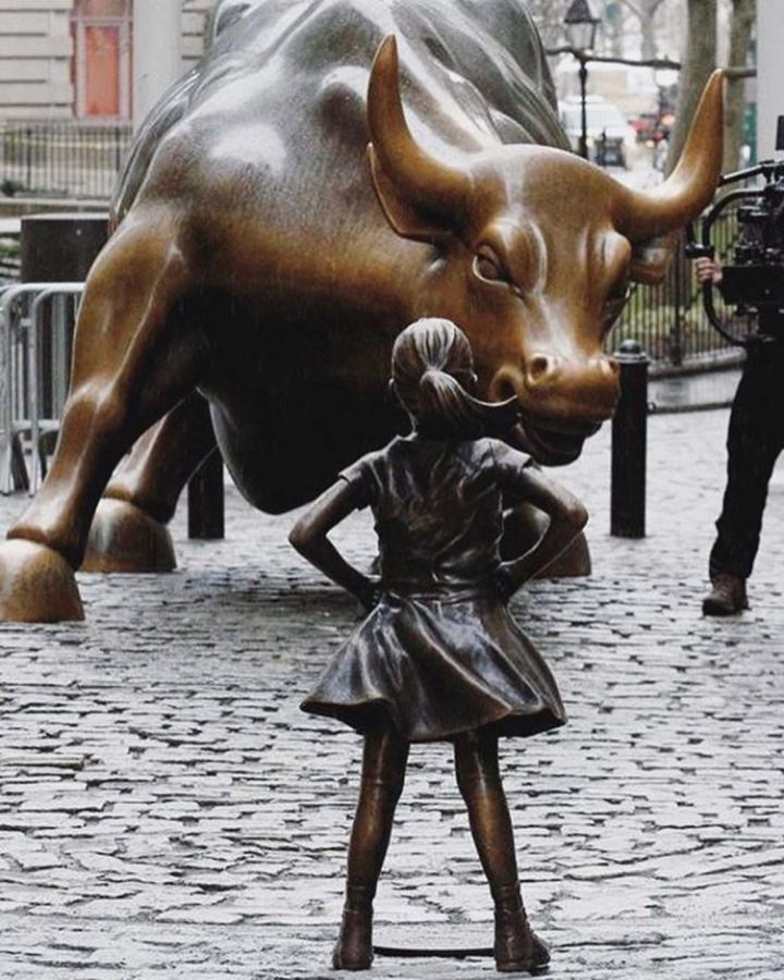 Fearless Girl statue standing up to the Wall Street Bull, an effort by asset management company State Street Global Advisors to encourage other companies to put more women on their boards. 