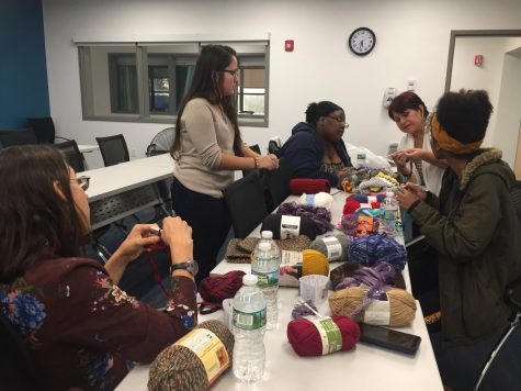 Mercy students and volunteers learn how to knit with the help of The Madristia Project founder Susana Luna and her daughter, Christal Luna.